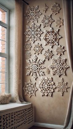 a window sill with snowflakes on the wall