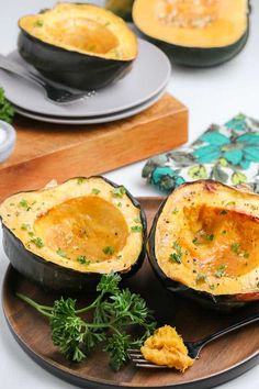 an eggplant stuffed with cheese and parsley on a plate next to other dishes