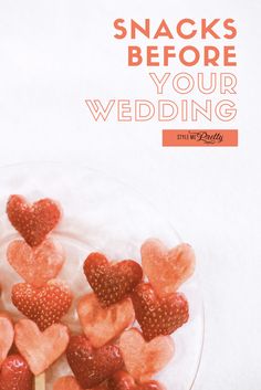 there is a plate with strawberries in the shape of hearts on it and text reads snacks before your wedding