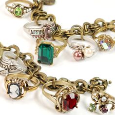 Simply charming and a guaranteed conversation starter, the charms on this bracelet are actual vintage finger rings from the 1940s and 1950s. These antique rings are finished in different metals - 14K plate, bronze and silver with both vintage and new stones and crystal. Double rolo chain closes with a byzantine style spring ring clasp. Rings may vary due to limited availability but all are fantastic representatives of their era. You will not be disappointed. Size: adjustable to 8" long. Made by Gold Ring Vintage, Upcycled Vintage Jewelry, Antique Rings Vintage, Antique Style Rings, Vintage Jewelry Crafts, Vintage Charm Bracelet, Rings Vintage, Bracelets Diy, Repurposed Jewelry