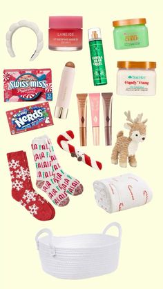 the contents of a christmas gift bag laid out on a white background