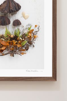 an art piece with mushrooms and leaves on it