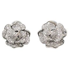 Stunningly sparkly pave diamond and 18 karat gold flower earrings. These elegant botanical earrings are wonderfully detailed with exquisite craftsmanship. The glittering diamonds really elevate the pair, allowing them to truly radiate on the ear. These absolutely gorgeous earrings feature 142 shimmering round brilliant pave diamonds, F-G in color, VS1-VS2 in clarity and totaling 1.53 carats. The life-like petals are intricately designed and layered using polished 18 karat white gold, allowing th Diamond Flower Earrings, Gold Flower Earrings, Botanical Earrings, Bridal Earrings Drop, Flower Ear, Jewelry Appraisal, Flower Motif, Earrings Drop, Gold Flower