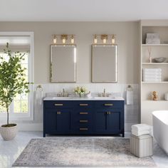 a bathroom with two sinks, a bathtub and a tree in the middle of it