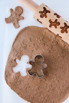 an easy gingerbread salt dough ornament is cut out and placed on a cookie sheet