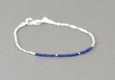 ∞ Please find out my other items here: www.etsy.com/shop/Zzaval ∞ Bracelet made with Sterling silver and tiny Lapis lazuli beads So easy to wear Sterling silver clasp IMPORTANT:This listing is only for the tiny lapis lazuli and silver beads Bracelet If you like the other bracelet on wrist picture please go to: https://www.etsy.com/listing/174302757/square-sterling-silver-beads-bracelet --Please check shipping options before you order-- Blue Beaded Bracelets With Sterling Silver Clasp, Sterling Silver Beaded Bracelets With Tiny Beads, Blue Beaded Sterling Silver Bracelet, Silver Beaded Lapis Lazuli Bracelets, Bracelet On Wrist, Lapis Lazuli Bracelet, Lapis Lazuli Beads, Silver Bead Bracelet, Beads Bracelet