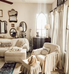 a living room filled with furniture and mirrors