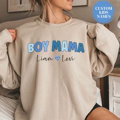 Personalized Boy Mama Sweatshirt With Kids Names Custom Mama Sweater Mothers Day Gift Mama Birthday Gift Momma Sweatshirt Custom Mom Crewneck Boy Mama Shirt Gift for Mama Gift Postpartum Gift Expecting Mom Gift The perfect vintage cozy sweatshirt for a stylish Boy Mama! This Personalized Boy Mama Sweatshirt With Kids Names makes the perfect Gift for Mama Birthday Gift or Mothers Day Gift for Mama. It's made from a soft, midweight cotton-blend fabric for easy layering when it gets chilly or throw it on alone for comfort. Full of style and comfort, we think this sweatshirt has all the qualities cool Mama could ever want. Runs true to size, but size up if you'd like a more oversized fit. *Please note - At this time, we are not able to offer gift messaging, wrapping or notes, please send a sep Cotton Letter Print Sweatshirt For Gender Reveal, Graphic Print Sweatshirt For Birthday And Mother's Day, Long Sleeve T-shirt With Letter Print For Gender Reveal, Mother's Day Birthday Graphic Print Sweatshirt, Personalized Crew Neck Sweatshirt For Birthday, Mother's Day Birthday Crew Neck Sweatshirt, Boy Mama Sweatshirt, Custom Mama Sweatshirts, Mother's Day Crew Neck Sweatshirt With Lettering