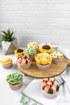 Assortment of flowers and succulents hand-piped onto vanilla cupcakes. Flowers range from chamomile, sunflowers, roses, succulents, and tulips. Brunch Cupcakes, Plant Cupcakes, Garden Lovers, Look Alike, Mini Cupcakes