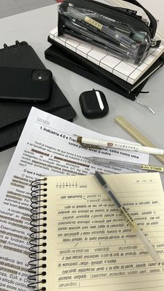 an open notebook and pen on a table