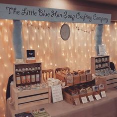 the little blue hen soap crafting company booth is set up for customers to purchase