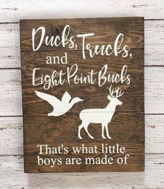 a wooden sign that says ducks, trucks and eight point bucks that's what little boys are made of