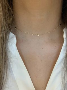 Make a standout statement with our 14K Gold Stars Adjustable Choker & Layering Necklace! Crafted with real gold and featuring a minimalist jewelry style you'll love, it's perfect for any night out or special occasion. ♦ Materials: 14K Gold♦ Necklace Measurements: Lighting Bolt choker can be adjusted to any length, total length possible is 15.75", stars measure 6MM, chain is a cable chain about 1MM thick----------------------------------------------------------------------------MATERIALSAll chain Simple Star Necklace, Jewellery Aesthetic, Necklace Measurements, Lighting Bolt, Star Necklace Gold, Gold Necklace Simple, Golden Necklace, Gold Choker Necklace, Jewelry Style