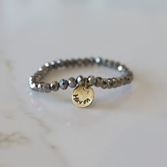 Add some bling to your wrist with our Personalized Crystal Stacks! You can personalize your stack bracelet with a name, date, initials, or a word of choice on a simple, classic disc charm. With neutral colors and faceted beads that shine and shimmer in the light, you can be reminded of a motivating word, memory, or special loved one whenever you look down at your wrist! A perfect gift for the everyday stack wearing lover! *Elastic stack bracelets are made with 6mm faceted crystals *Personalized Adjustable Nickel-free Name Bracelet For Everyday, Personalized Silver Beaded Bracelets For Everyday, Everyday Stackable Round Name Bracelet, Adjustable Round Name Bracelet For Everyday, Everyday Silver Stackable Name Bracelet, Silver Stackable Name Bracelet For Everyday, Silver Beaded Bracelet With Custom Name For Everyday, Customizable Silver Stretch Bracelet, Adjustable Silver Stretch Bracelet Customizable