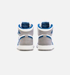 This offering of the Air Jordan 1 features a White leather base with Grey and Blue overlays atop a White midsole and Grey rubber outsole. Jordan 1 High Og, Blue And White Style, Air Jordan 1 High, Jordan 1 High, True Blue, Air Jordan 1, Blue Shoes, Jordan 1, White Leather