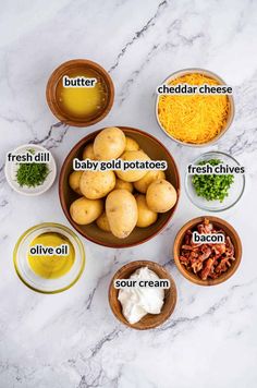 the ingredients to make this potato salad are shown in bowls on a marble countertop