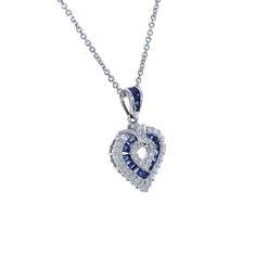 "This marvelous open heart shaped gemstone pendant necklace showcases baguette cut sapphires set in a channel setting & crafted in 14k white gold.The contemporary heart shaped pendant features bright round cut diamonds 0.50 c.t.w., color/clarity G,H-SI alternating with baguette cut sapphires 0.50 c.t.w. Enjoy a matching 14k white gold 18\" long chain with your purchase. Chain secures with lobster claw clasp. Necklace weight is 5.6 grams. For more information, contact Avital & Co Jewelry Formal Sapphire Heart Pendant Jewelry, Sapphire Heart Pendant Jewelry For Anniversary, Heart-shaped Sapphire Necklace For Formal Occasions, Formal Heart-shaped Sapphire Jewelry, Heart-shaped Sapphire Necklace For Formal, Anniversary Sapphire Jewelry With Heart Charm, Fine Jewelry Sapphire Heart Pendant, Heart-shaped Sapphire Jewelry For Formal Occasions, Sapphire Heart Pendant For Anniversary