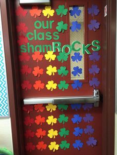 a door decorated with shamrocks and the words our class shamrocks