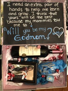 an open box containing wine and personalized items for someone's special occasion,