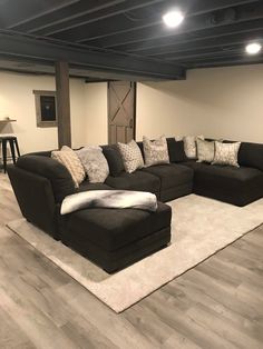 a large sectional couch sitting on top of a white rug