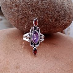 HELLO BUYERS  WELCOME MY SHOP ! ✦ Visit our Etsy shop : https://www.etsy.com/in-en/shop/poojasilvershine?ref=seller-platform-mcnav and check out all our styles in Jewelry :) Amethyst and Garnet ring, Boho amethyst ring, Sterling Silver Ring, Bridesmaid Rings, natural gemstone ring, designer ring, Gift for mother 》D E T A I L S《 GEMSTONE DETAILS : ✦ Gemstone: Natural amethyst and garnet  ✦ Gemstone Type: Natural ✦ Gemstone Shape: marquise (leaf) ✦ Gemstone Color: purple and red ✦ Gemstone Type: C Gift Marquise Amethyst Ring, Marquise Amethyst Ring Gemstone Gift, Marquise Amethyst Ring Gift, Unique Amethyst Multi-stone Rings, Fine Jewelry Amethyst Ring Gift, Marquise Amethyst Ring As Gift, Marquise Gemstone Stackable Rings Gift, Spiritual Amethyst Rings With Accent Stones, Marquise Amethyst Jewelry Gift