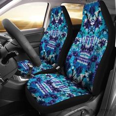 the interior of a car with blue and green flowers on it