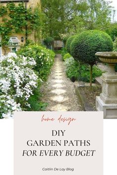 a garden path with white flowers and bushes