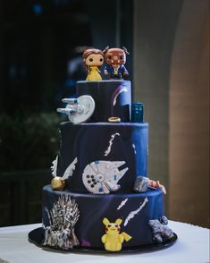 By Roseberry Cake Creations - 3tier Dark Blue & Purple marbled Pop Culture themed wedding cake for alternative, nontraditional wedding with handmade fondant figurines to match each of the themed wedding guest tables- Star Wars, Star Trek, Harry Potter, Doctor Who, Lord of the Rings, Game of Thrones, Firefly, Pikachu, Alien Star Wars Wedding Cake, Geeky Chic, Purple Wedding Cake, Wedding Guest Table, Cakes To Make, Edible Decorations, Ring Cake, Edible Creations