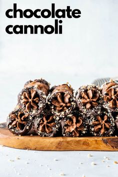 chocolate candies on a wooden board with the words chocolate cannoi above them