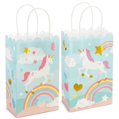 two bags with unicorns and rainbows on them, one is blue the other is pink