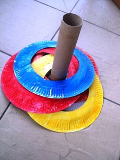 a paper plate with a roll of toilet paper on top of it