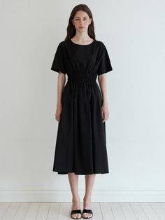 Comfortable yet elegant dress that has soft texture. Featuring the basic rounded neckline, slim waistline with shirring detail, and flared silhouette. The side pockets also elevated the practicality. - Rounded neckline and short-sleeved design- Shirring and pin tuck detail at waist- Slim waistline and flared silhouette- Side pockets detail- One-button closure detail at back Black Midi Dress With Ruched Bodice For Work, Black Midi Dress With Gathered Waist For Work, Black Dress With Smocked Back For Work, Rounded Neckline, Pin Tucks, Slim Waist, Soft Texture, Pocket Detail, Elegant Dress