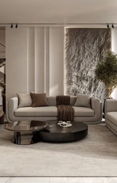 a modern living room with two couches and a coffee table