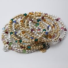 Our handmade Beaded Birthstone Bracelet is the personalized accessory, crafted with classic gold-filled or sterling silver round beads, the sparkling birthstone crystals add a colorful, timeless touch to your look. With 13 birthstone options, it's perfect for stacking or wearing solo and can be customized to represent your family and loved ones. Made with a balanced blend of 4mm metal beads and colorful birthstones, it's a beautiful yet subtle way to honor those close to your heart. Arrives gift Birthstone Crystals, Handwriting Jewelry, Birthstone Bracelet, Birthstone Bracelets, Classic Gold, 50th Gifts, Tape Measure, Metal Finishes, Flower Jewellery