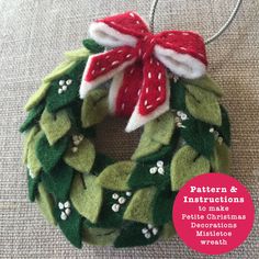 a christmas wreath ornament hanging on a wall