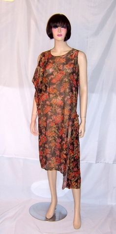 "This is an elegant 1920's French lame orange, yellow ochre, and gold on black chiffon, sleeveless dress. The fabric is rich and luxurious. There is a sash at the right shoulder through which the arm goes through and another sashat the left hip. The dress measures 34\" around the bust line and 37\" around the hip line There is no defined waist. There are no snaps nor hooks and eyes for closure and the dress must be slipped over one's head to be worn.It is in excellent vintage condition." Crochet Lace Shorts, Black Chiffon Dress, 1920s Outfits, Natural Hair Art, Yellow Ochre, Black Chiffon, Orange Dress, Orange Yellow, Black Satin