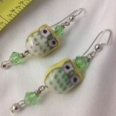 Handmade owl bead earrings with pastel yellow and green color palette #owl earrings #handmade #jewelry #earrings #pastel #beading #beadwork Yellow And Green Color Palette, Green Color Palette, Handmade Jewelry Earrings, Owl Earrings, Green Colour Palette, Pastel Yellow, Yellow And Green, Bead Earrings, Earrings Handmade