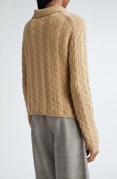 Classic cables in a luxurious wool and cashmere blend refine a polo-sweater that brings sporty energy to any look. 20" length (size Medium) Button half placket Spread collar Long sleeves Ribbed cuffs and hem 67% wool, 27% cashmere, 5% nylon, 1% spandex Hand wash, dry flat Imported Designer Long Sleeve Cashmere Sweater, Luxury Long Sleeve Polo Sweater For Winter, Luxury Cashmere Sweater With Ribbed Collar, Luxury Cashmere Polo Sweater With Ribbed Collar, Cozy Cable Knit Wool Polo Sweater, Classic Cable Knit Polo Sweater, Luxury Polo Sweater With Ribbed Collar For Winter, Luxury Winter Polo Sweater For Workwear, Luxury Polo Sweater For Winter Workwear