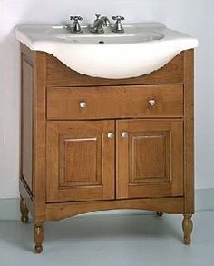 a bathroom vanity with a sink and wooden cabinet