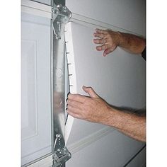 a man is measuring the width of a door