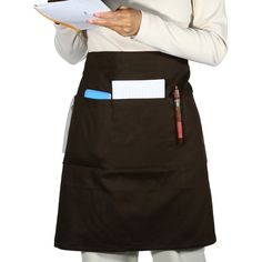 a woman in an apron holding a clipboard and pen