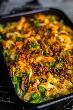 a casserole dish with green beans and onions