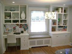 a living room filled with furniture and lots of shelves on top of it's walls