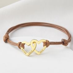 "A symbol of everlasting love, this heart interlocking mother bracelet is engraved with kids' names. ► PRODUCT INFORMATION * Material: High Quality Solid 925 Sterling Silver * Finishing: Silver, 18k Gold or Rose Gold. * Heart Dimensions: ~21/32\" (17mm) * Word limits: 2 names/heart * By default, silver items comes with BLACK engraving and gold-plated item comes with CLEAR engraving We recommend ordering a size 1/2'' to 3/4'' larger than your actual wrist size. * All of our jewelry are handmade f Adjustable Jewelry For Father's Day Personalized Gift, Friendship Bracelets With Double Heart Charm, Personalized Double Heart Bracelets For Mother's Day, Minimalist Bracelet For Mother's Day Gift, Minimalist Adjustable Charm Bracelet For Mother's Day, Minimalist Bracelet For Mother's Day, Personalized Adjustable Promise Jewelry, Promise Jewelry With Engraving Option For Valentine's Day, Adjustable Bracelets For Mother's Day Anniversary