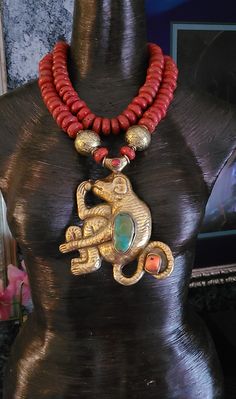 Tibetan Brass Repousse Monkey Pendant with Inlaid Turquoise & Coral measures 6" x 4.5". This is very rare since it is done in a warm metal; most are done in cool tones. Non-adjustable 19" in length - comprised of Nepalese Vintage Red Glass Sherpa Beads which are rustic looking (collectors prefer these). Two huge brass beads flank the pendant. Finished with four large, fancy ornate ethnic beads. Closes with gold tone hardware and a lobster claw clasp. If requested, I can add an extender chain fre Artisan Turquoise Necklace In Gold For Festival, Artisan Gold Turquoise Necklace For Festival, Traditional Hand-strung Turquoise Necklace For Festival, Artisan Turquoise Necklace For Festivals, Traditional Gold Beaded Turquoise Necklace, Rocker Chic Accessories, Unique Pendant Necklace, Statement Bib Necklace, Ethnic Necklaces