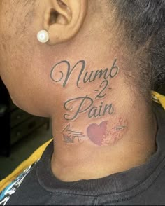 the back of a man's neck with words and hearts tattooed on his neck