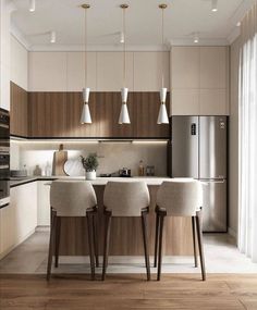 a kitchen with three stools next to an island