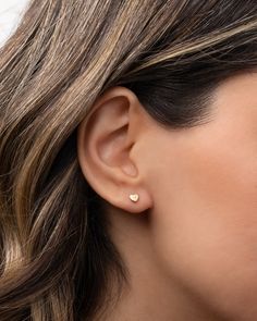 14k gold tiny heart with diamond stud earring. Part of our Tiny Stud collection, this is sold as a single and great for mixing and matching or purchase two for a dainty pair. Available in 14k yellow, white and rose gold. Sold as a Single Size: Approx. 4mm (W) by 4mm (H) Diamond: approx 0.01 ctw Standard Production: 2-7 business days Rush Order Production: 1- 4 business days Shipping: Select shipping method at checkout. Shipped from our L.A. Studio. This item is Final Sale. See here for details. Dainty 14k White Gold Heart Earrings, Dainty Yellow Gold Heart Earrings For Everyday Wear, Tiny Dainty Yellow Gold Heart Earrings, Minimalist White Gold Heart Earrings For Everyday, Dainty Tiny Yellow Gold Heart Earrings, Tiny Heart-shaped 14k Gold Earrings, Tiny Rose Gold Heart Earrings, Dainty Rose Gold Heart Earrings, 14k Gold Dainty Heart Cut Earrings