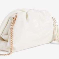 New In The Original Packaging Understated Leather Clamshell Clutch/ Crossbody This Clutch Embodies A Stylish Frame That Makes An Elegant Statement For Your Everyday. Vegan Leather Detachable Crossbody Chain Dust Bag Included Gold Tone Hardware Tassel Accents Buttery Soft White Leather Clutch With Detachable Strap, White Crossbody Clutch With Detachable Strap, White Leather Clutch With Removable Pouch, White Satchel Clutch With Detachable Strap, Trendy White Pouch Clutch, Crossbody Clutch For Errands, White Clutch With Detachable Strap For Travel, Elegant Leather Clutch For Errands, Chic White Faux Leather Shoulder Bag