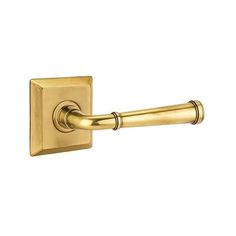 an antique brass door handle on a white background